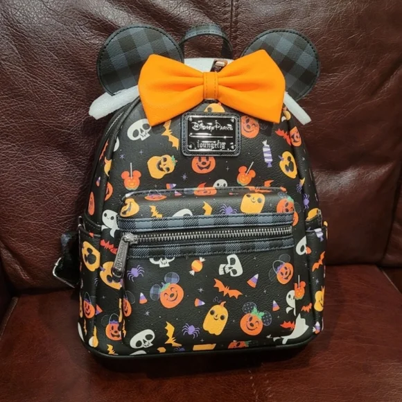 Disney Loungefly Minnie Mouse Halloween mickey mouse pumpkin treats Amazon.com: Loungefly Disney Glow FACE Minnie Pumpkin MINI  main image 2